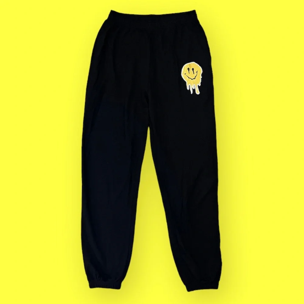 SOLD- Drip Melting Smiley Face Jogger Sweatpants Size Medium - Picture 1 of 5